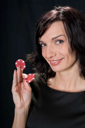 Young lucky gambler with chips in hand の写真素材