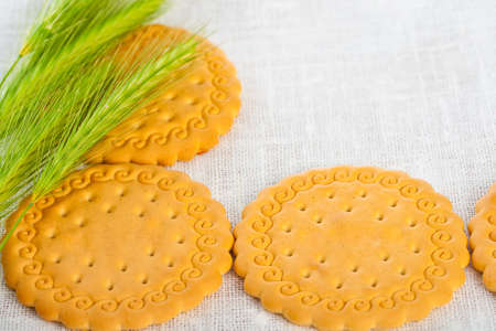 Green ears with pastry on white napkin 