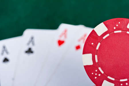 Chip and cards for the poker on the table. 