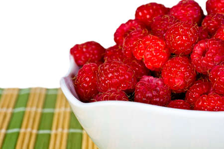 ripe juicy cherries on a white napkin on the grassy saucerの写真素材