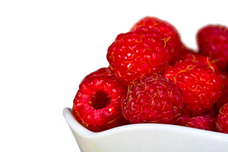 ripe  red wild raspberries isolated on white  backgroundの写真素材