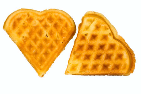 homemade waffles in the shape of  heart isolated on white backgroundの写真素材