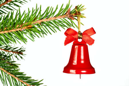 spruce twig and Christmas bell isolated on white backgroundの写真素材