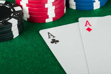 Chip and cards for the poker on the table の写真素材