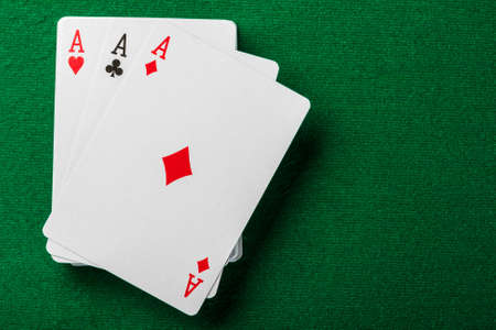 Cards and pack of playing cards on the table の写真素材