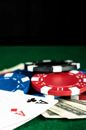 Group of chips, money and poker cards on the green cloth の写真素材