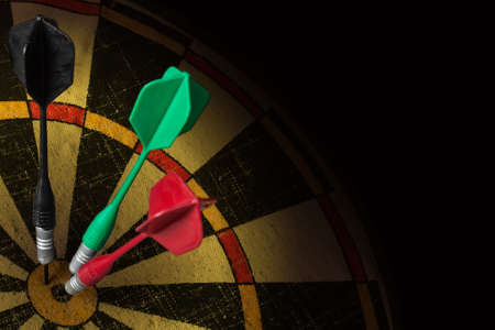 old dart board on dark backgroundの写真素材