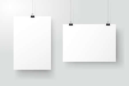 White posters hanging on binder. Grey wall with mock up empty paper blank. Layout mockup. Vertical and horizontal template sheet.のイラスト素材
