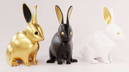 Three lovely ceramic bunny ornaments with golden ears. Animal characters gold, black and white. Realistic 3d illustration on white background. 2023 Year of the rabbit according to the Chinese zodiac.の写真素材