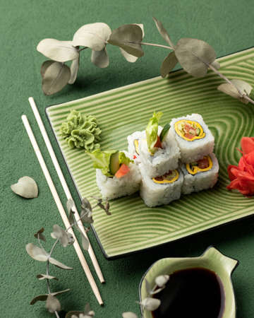 Sushi rolls. Vegetarian inside out sushi with fresh vegetables. Asian or Japanese food, Oriental...