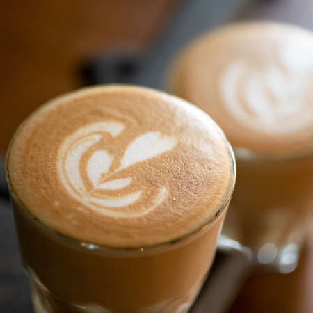 Cup of cappuccino with love. Rest break for two with natural coffee with painted heart on delicate...