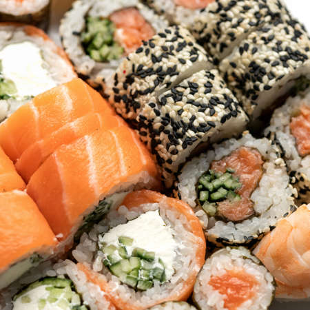 Sushi roll. Inside-out mixed Sushi Set. Close up shot. Traditional Japanese food. Healthy Oriental...