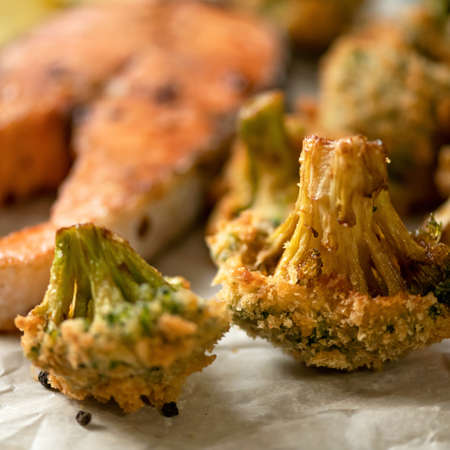 Close up of broccoli cabbage fried in breadcrumbs. Vegetable garnish for salmon steak. Soft focus.の写真素材