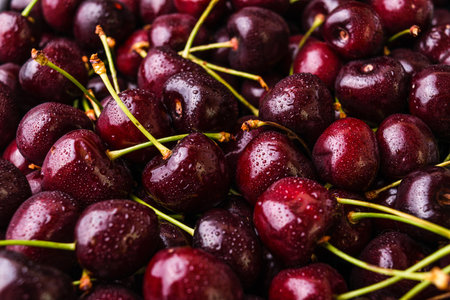 Ripe cherries with waterdrops background. Closeup view.