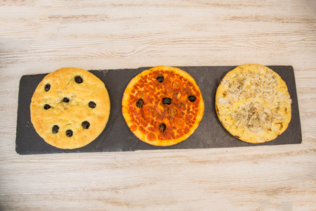 Fresh pizza on a wood, ready for submissionの写真素材