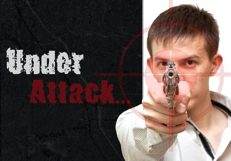 Collage guy with a gun. At gunpoint. Under attackの写真素材