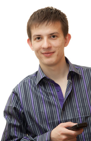 A young man with the phone in a shirt with a white backgroundの写真素材