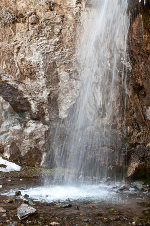 Falls in the snow in the spring. Kegety canyon in Asia, Kyrgyzstanの写真素材