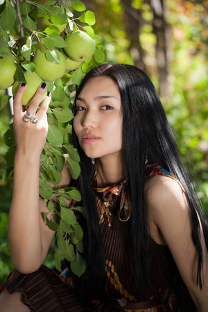 The girl in the garden with Pearsの写真素材