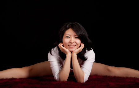 Asian girl in a studio on the red carpetの写真素材