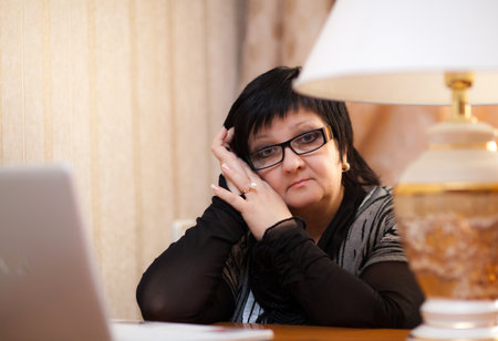 Office Woman indoors with a laptopの写真素材