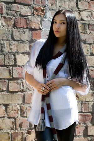 Beautiful girl against a wallの写真素材