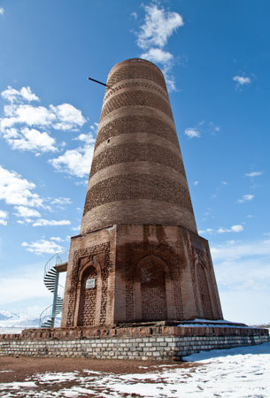 Ancient Kyrgyz Burana tower in the mountainsの写真素材