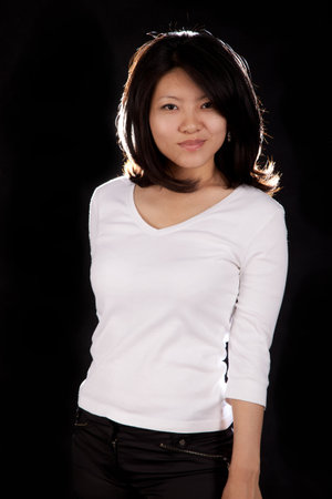 A korean girl on a black background with backlightの写真素材