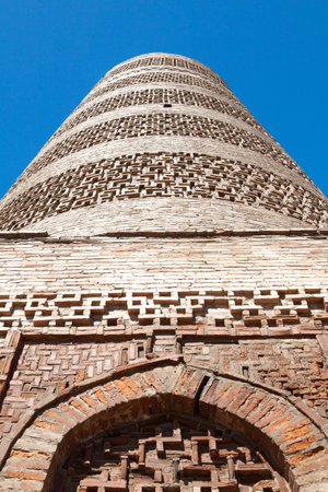 Ancient Kyrgyz Burana tower in the mountainsの写真素材