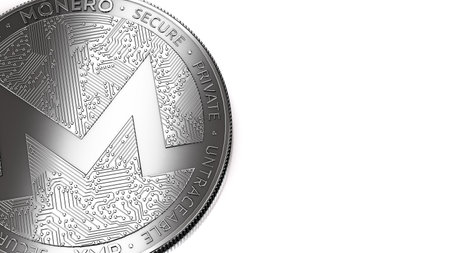 Macro shot of Monero (XMR) coin and copy space on the right where you can place your text or chart....