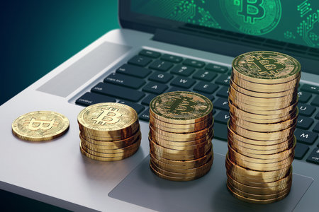 Growing piles of golden Bitcoin laying on computer keyboard. Bitcoin growing value concept. 3D renderingの写真素材