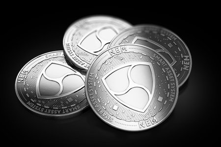 Stack of four silver NEM coins laying on the black background. 3D renderingの写真素材