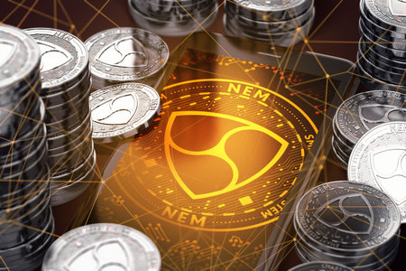 Smartphone with orange NEM symbol on-screen among silver NEM coins. NEM concept coin & virtual wallet. 3D renderingの写真素材