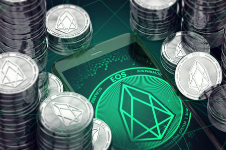 Smartphone with green EOS symbol on-screen among EOS coins.EOS concept coin & virtual wallet. 3D renderingの写真素材