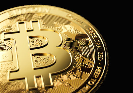 Golden Bitcoin in close-up shot on black background with copy space on the right. 3D renderingの写真素材