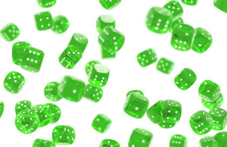 Green game dices threw in the air isolated on white backgroundの写真素材