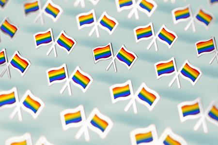 Shallow DOF focus on Rainbow LGBTQ flags pattern. Gay pride month symbol concept. Isolated on pastel...