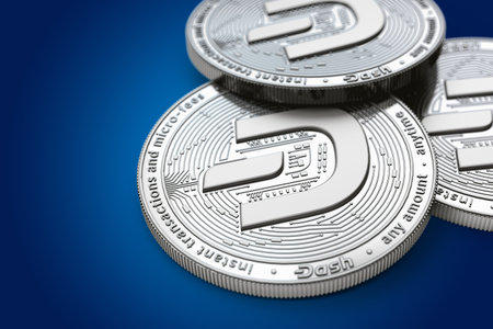 Macro shot of Dash coins with 2019 updated logo and copy space on the left where you can place your text or chart. Isolated on blue. 3D renderingの写真素材