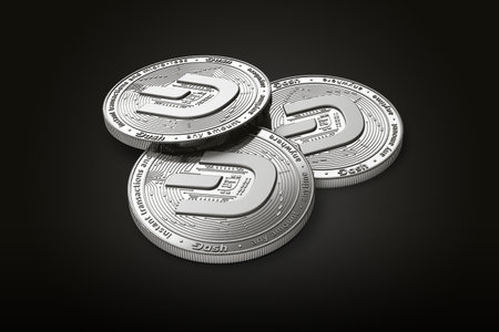 Stack of three silver Dash coins with 2019 logo update, isolated on black background. 3D renderingの写真素材