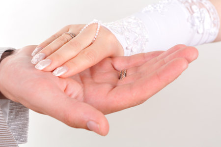 Bride and groom hands overの写真素材