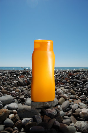Tube with sun protection on beach of ocean
