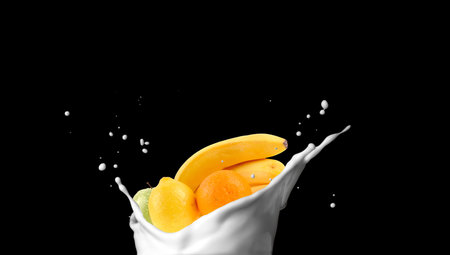 fruits in the milk splashの写真素材