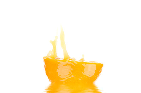 orange juice with splashの写真素材