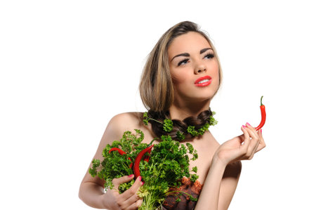 Young woman with chili pepper isolated on white 
の写真素材