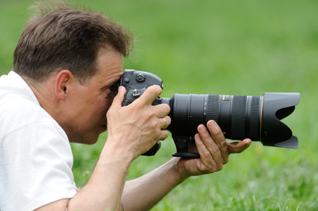 photographer taking photo in wild 