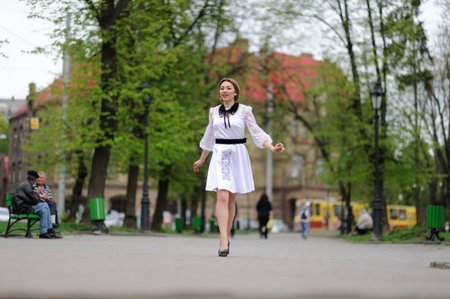 Happy girl running in the parkの写真素材