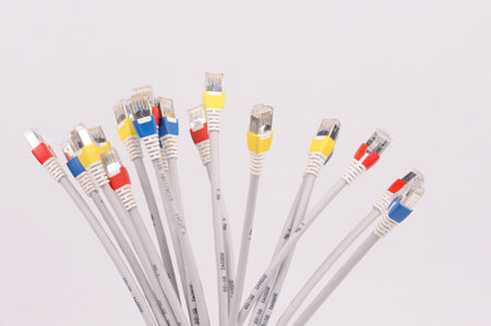 computer network cables over grey background 