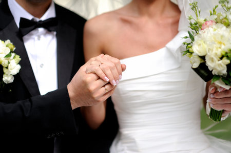 Bride and Groom wedding day, bride with bouquet of flowersの写真素材