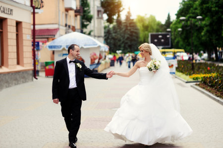 Happy bride and groom on their wedding dayの写真素材