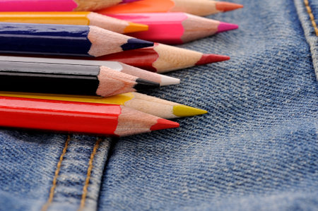 back to school  set of multicolored pencils in blue jeans pocketの写真素材